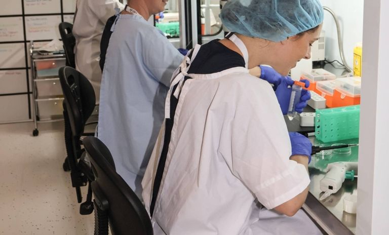 3 embryologists at work in the laboratory